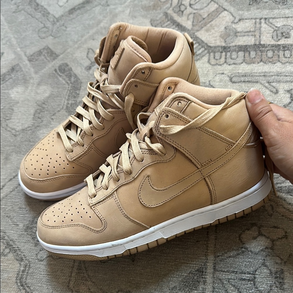 Women’s tan Nike high top dunks